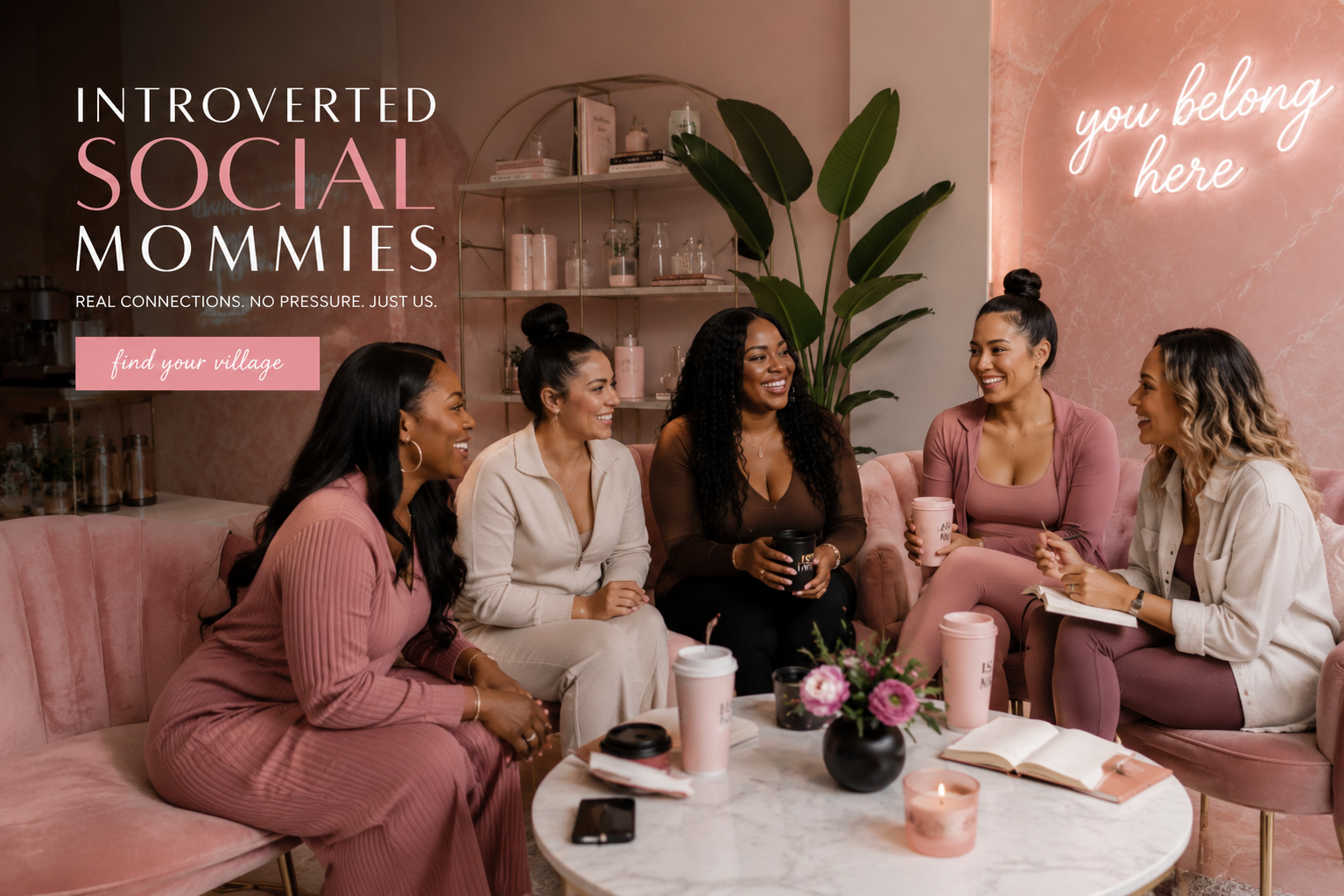 Five diverse mothers gathered on a blush pink velvet couch, laughing and connecting over coffee — Introverted Social Mommies